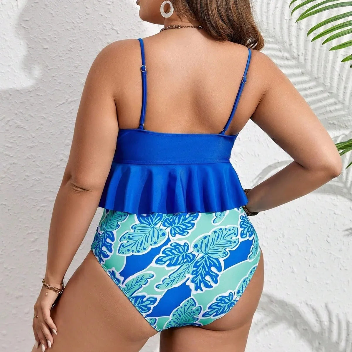 Blue women's two-piece bikini swimsuit with high-waisted briefs on a mannequin.