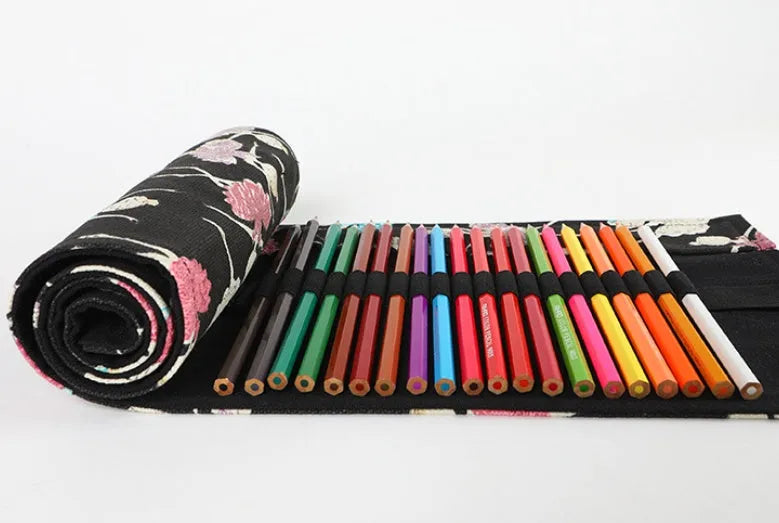 Canvas rolling pencil case with ballet girl print, showing multiple holes for colour pencils.