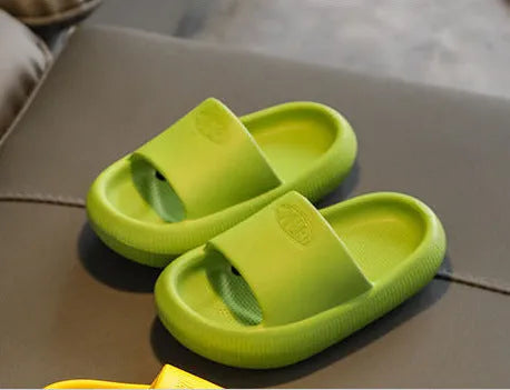 Children's EVA slippers in mixed colours with a textured non-slip sole, shown in sizes for kids.
