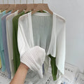 Women's hollow out blouse with long lantern sleeves in a linen blend fabric, shown in apricot colour.