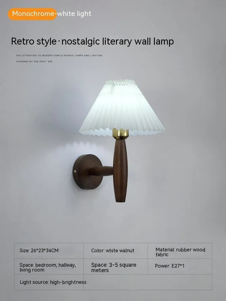 Walnut wood and copper American retro wall lamp with fabric shade on a wall.