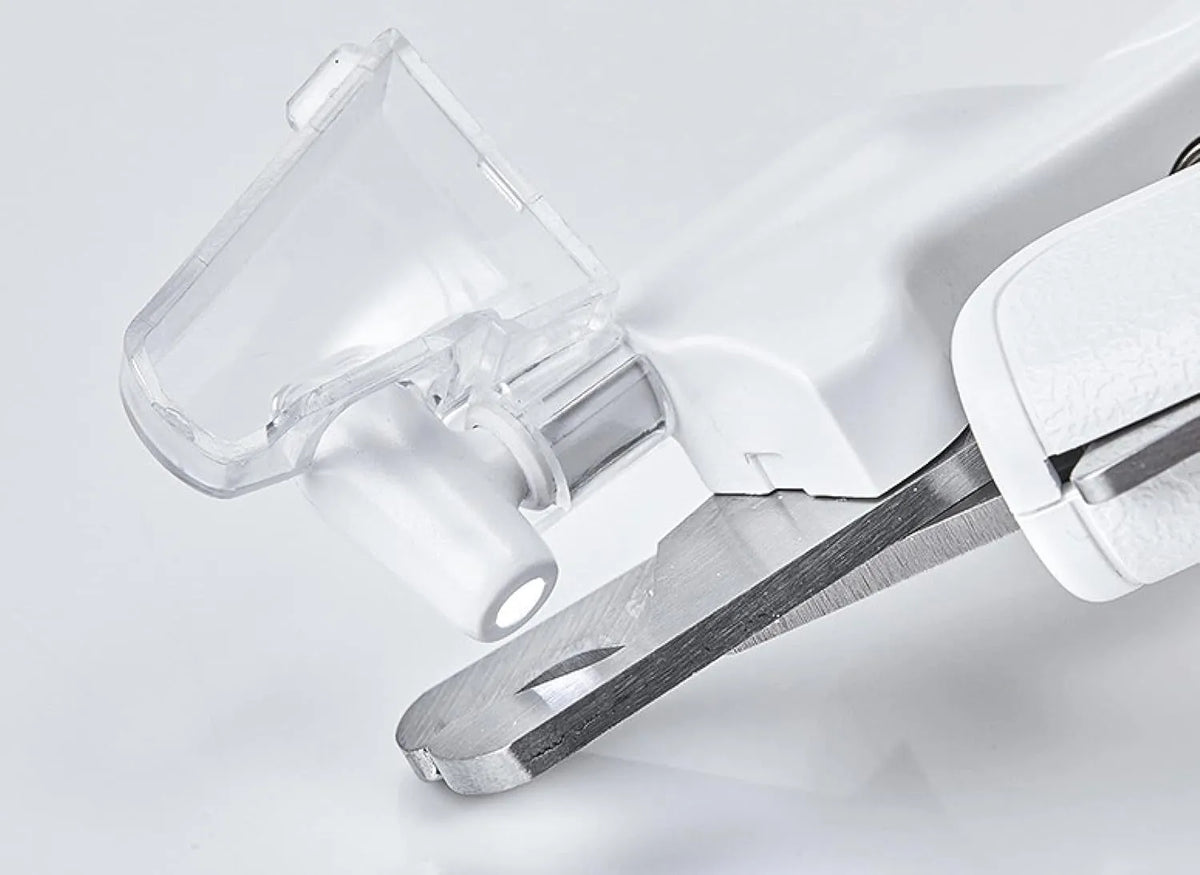 White LED pet nail clippers with transparent anti-splash guard open to show triangular stainless steel blades