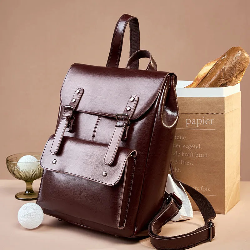 Women's cowhide leather computer backpack in black, brown, or coffee with hard structure and wear-resistant finish