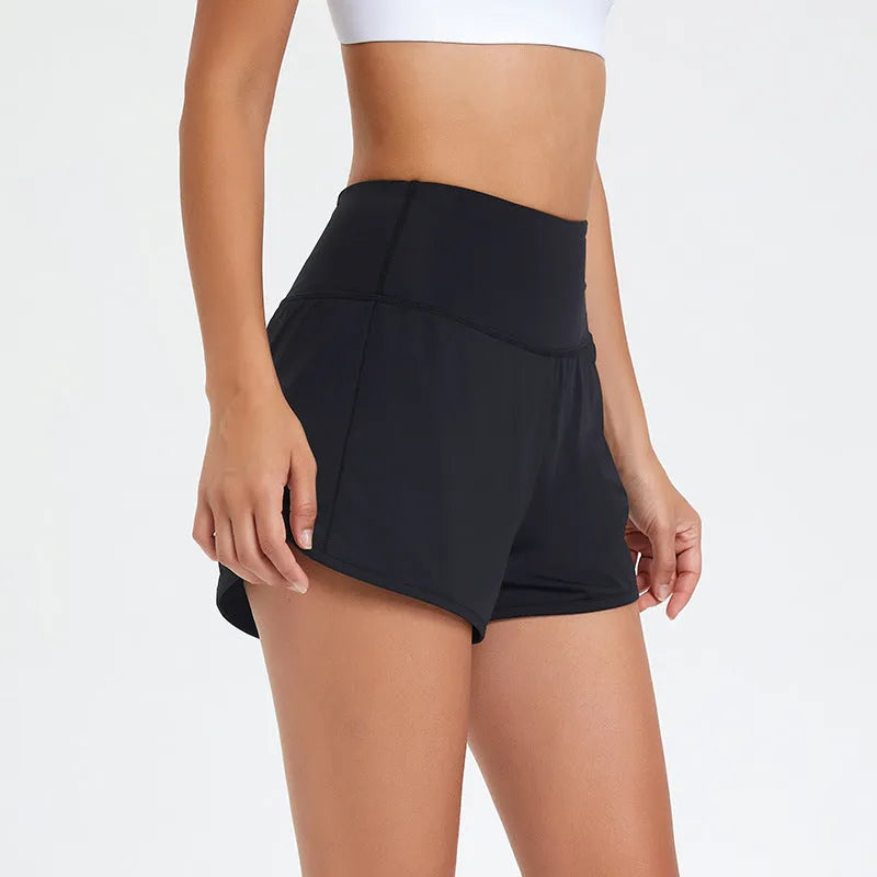 Women's high-waisted black nylon fitness shorts for running and gym workouts