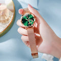 Women's fashion watch with rose alloy case and mesh strap, showing colour options with white, black, blue, red, pink, and green dials