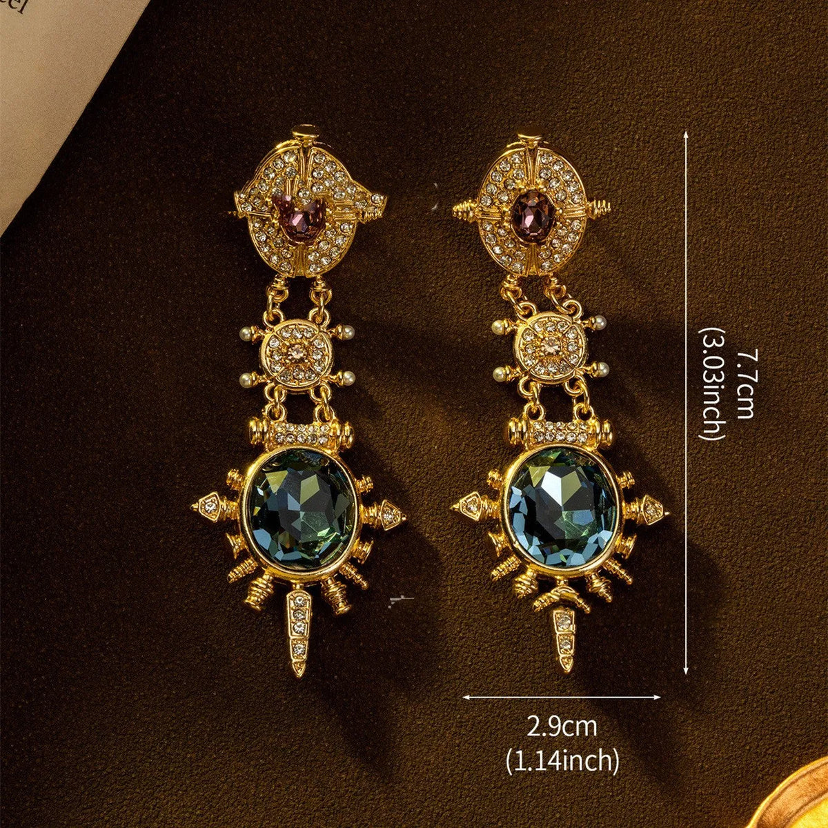 A pair of gold retro-style stud earrings with a geometry and round shape.