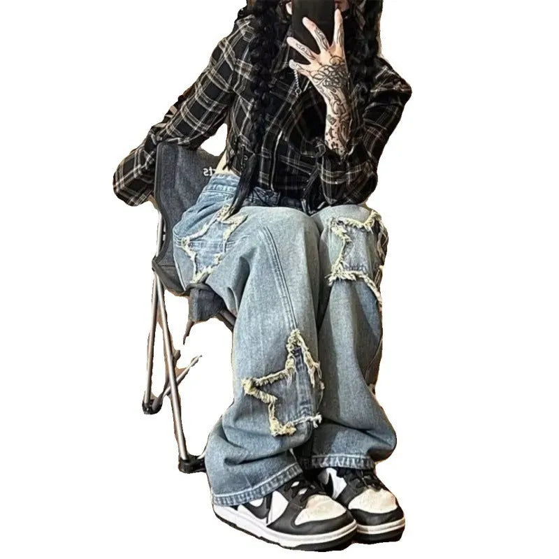 Blue high-waisted wide-leg denim jeans with a straight-leg cut on a model