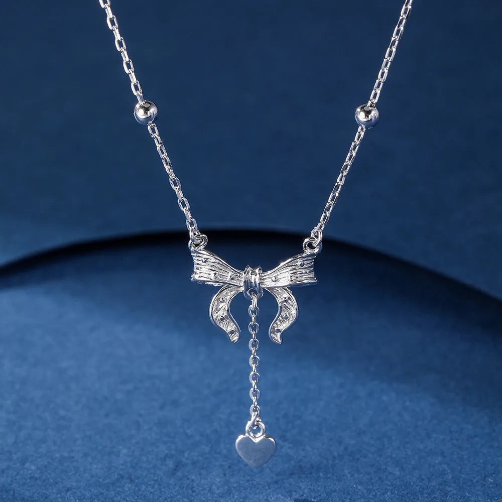 S925 sterling silver necklace with heart-shaped butterfly pendant on an adjustable O-ring chain.