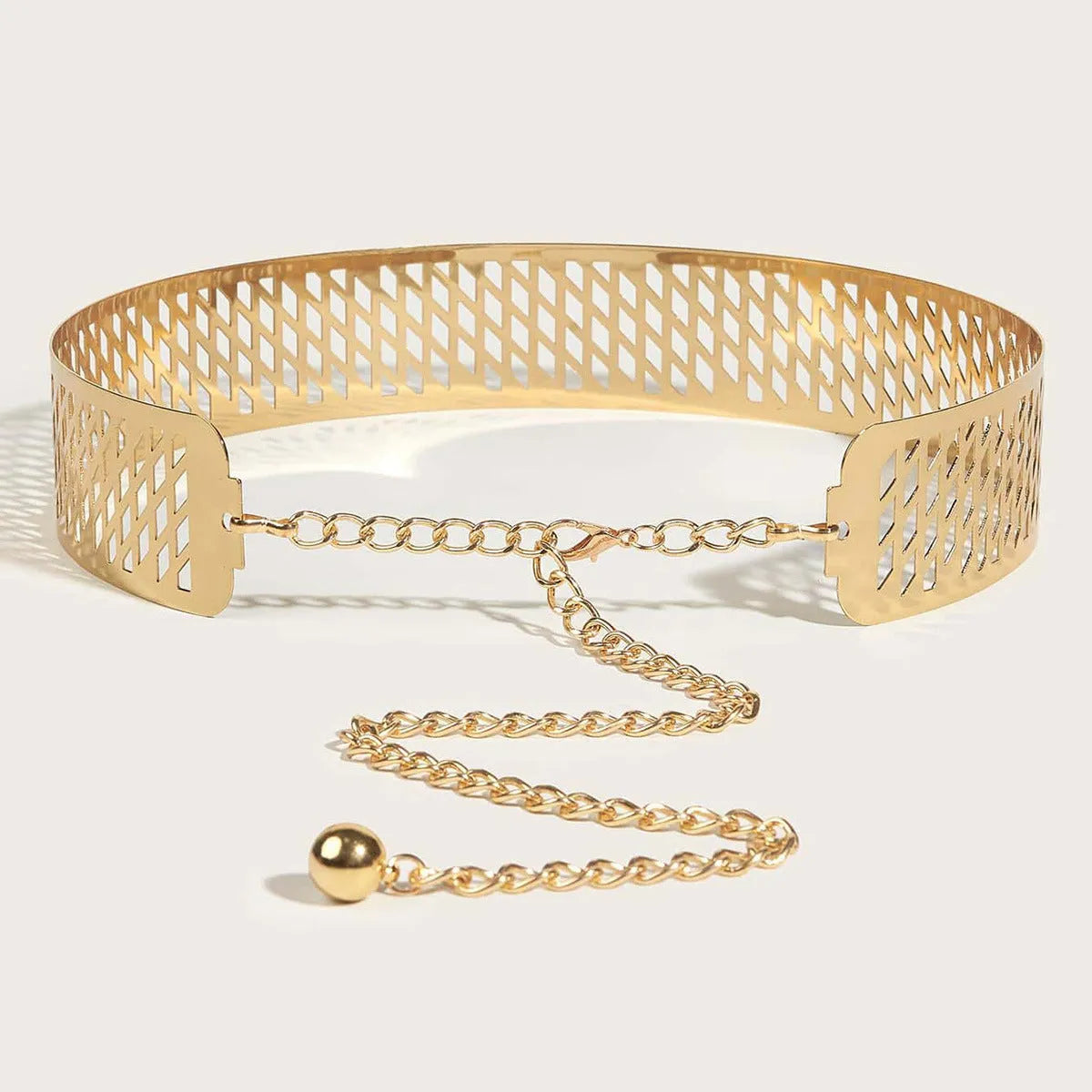 Golden alloy waist belt with lantern and floral punch net design, shown fastened, highlighting its 4.5cm width.