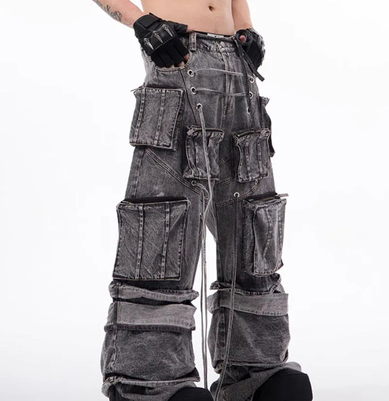 Grey distressed denim overalls for men with rope stitch detailing on the legs and chest.