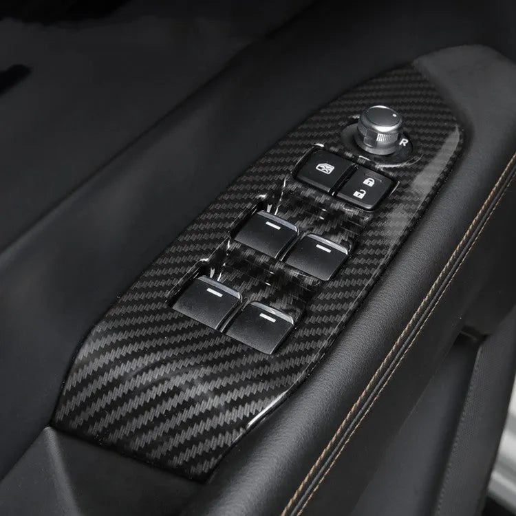 Pair of black ABS plastic steering wheel frame trims with adhesive backing for non-destructive car interior installation