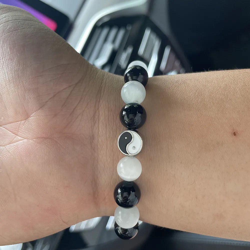 Natural stone Tai Chi bracelet with 10mm opal and black agate beads in traditional Chinese design