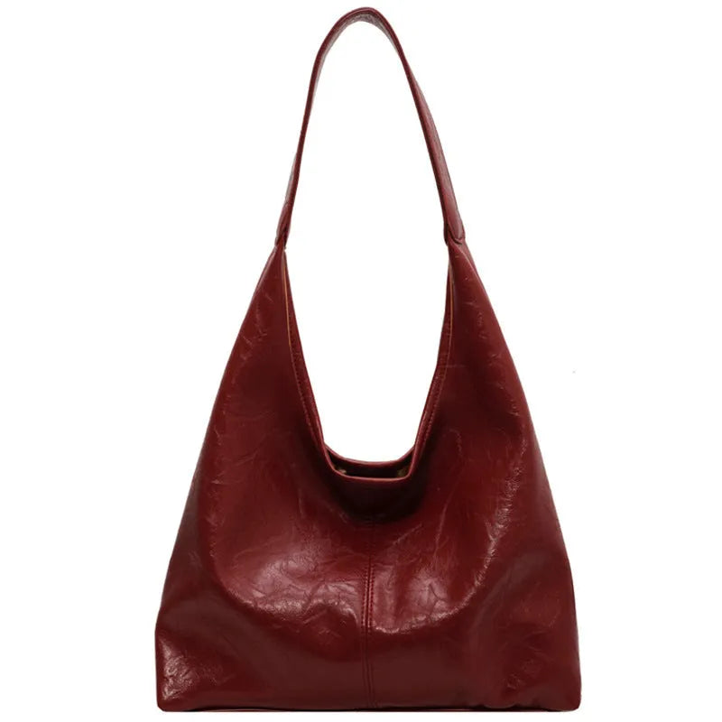 Soft leather casual shoulder bag with sandwich pocket design and large storage capacity