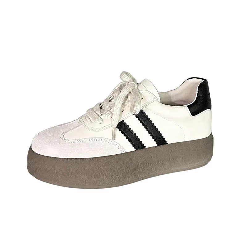 Women's beige distressed leather casual sneakers with round toe and lace-up front.