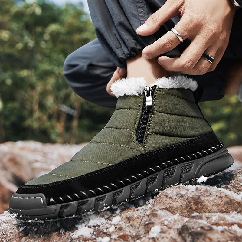 Men's plus size snow boot in a solid colour with a round toe, flat heel, and non-slip rubber sole.