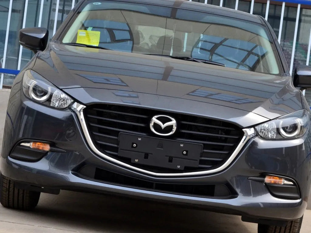 Mazda 3 Exela model headlamp replacement cover with snake glue adhesive.