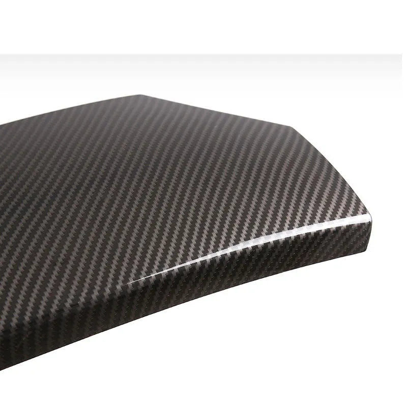 Set of three black ABS plastic car armrest box covers with a diagonal carbon fibre weave pattern.