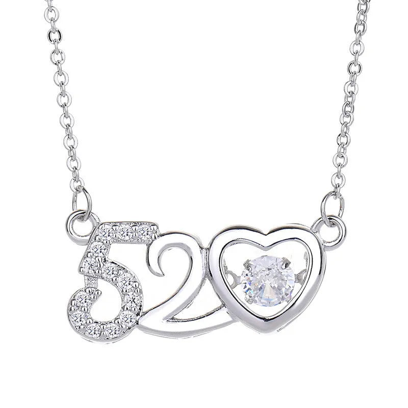 Silver love heart necklace with crown and bow details on clavicle-length chain