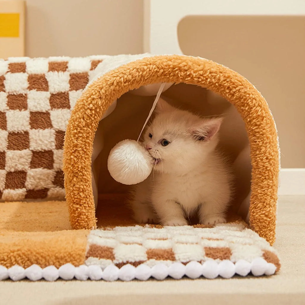 Coffee coloured fan-shaped plush pet bed with a tunnel entrance and anti-slip granular base.