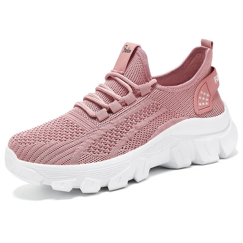 Women's white Flyknit sneakers with thick PVC sole and lace-up front