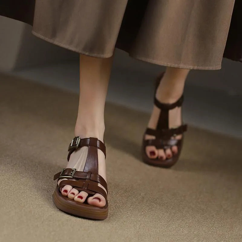 Black retro women's sandals with T-buckle, chunky platform heel and open square toe.