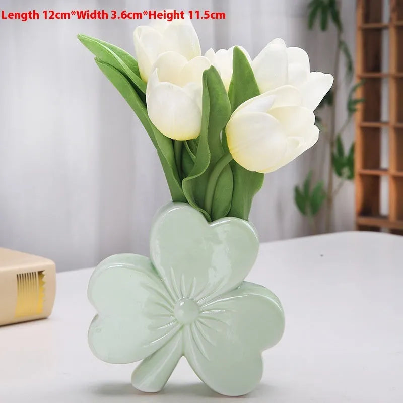 White porcelain clover-shaped ceramic vase in light green, pink, red, or white colours.