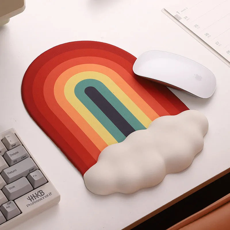 Silicone gel wrist rest mouse pad and keyboard support set in Cloud Rainbow design on a desk