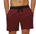 Men's blue drawstring fitness shorts with side pocket and stitching detail on the waistband.