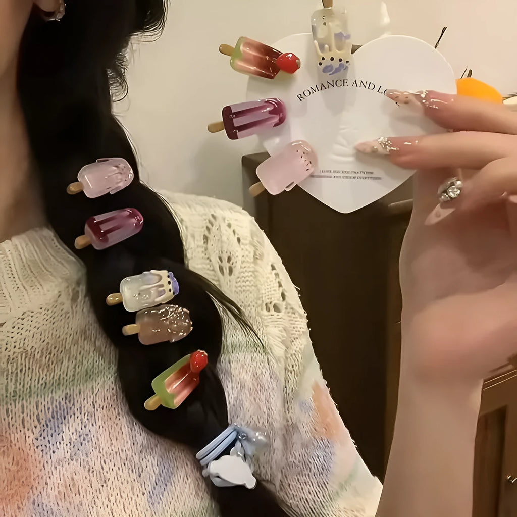 Cartoon ice cream themed resin barrette hair clip in side clip style on a colour background.