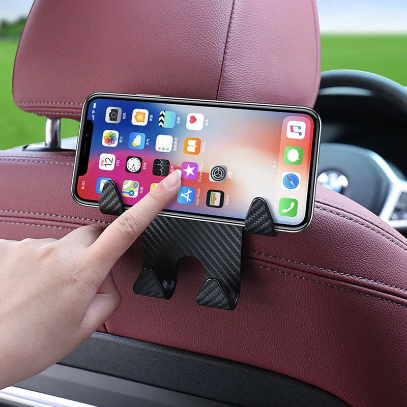Black ABS car hook with integrated mobile phone bracket for rear seat storage.