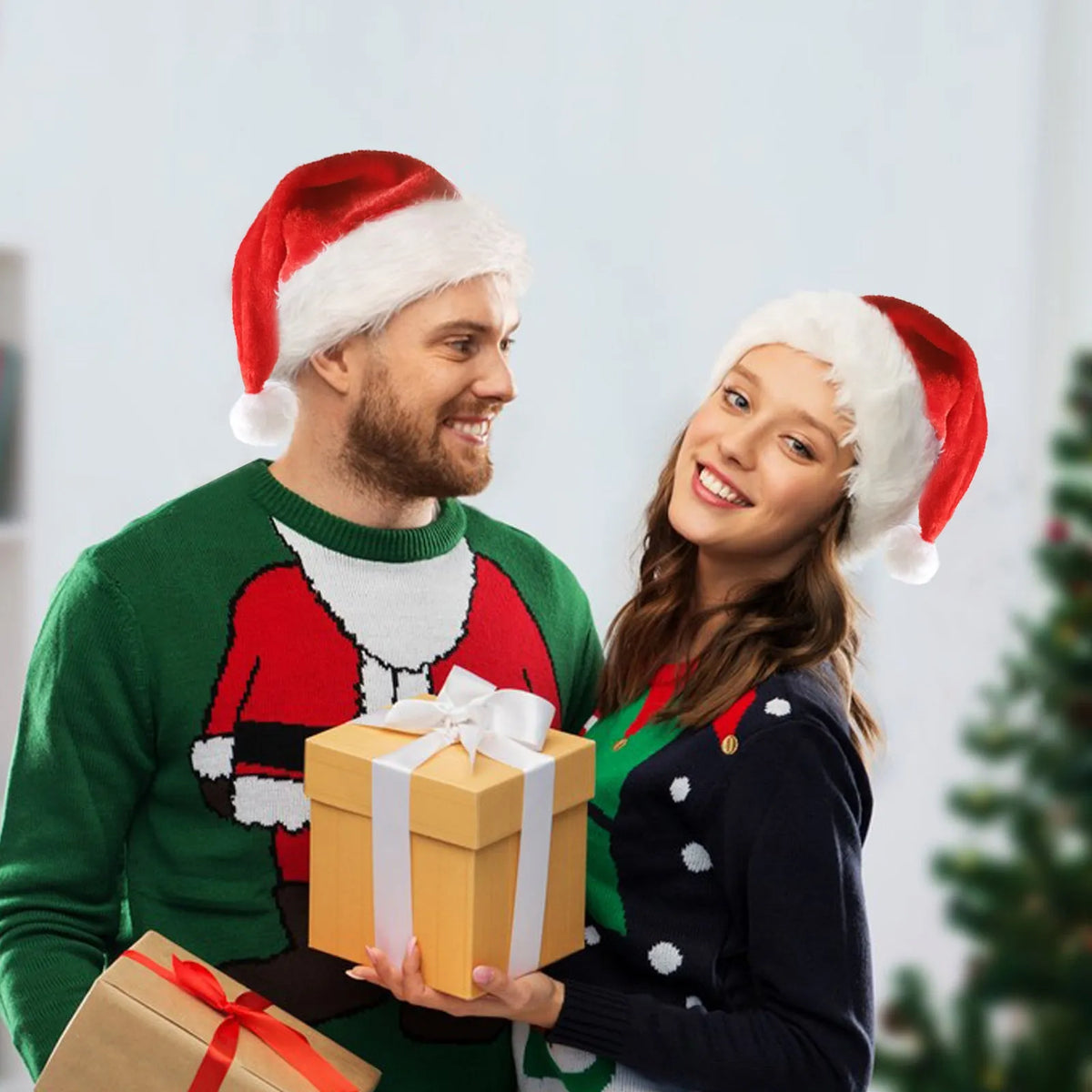Red and white plush LED Santa hat with pom-pom and multi-colour twinkling lights on model.