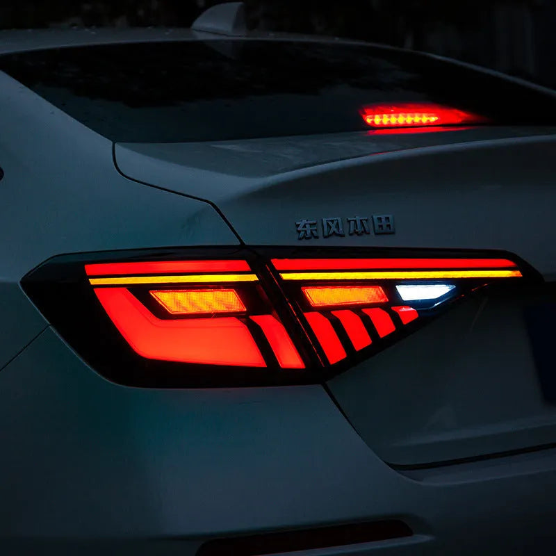 Black and red LED tail light assembly for 11th Generation Honda Civic.