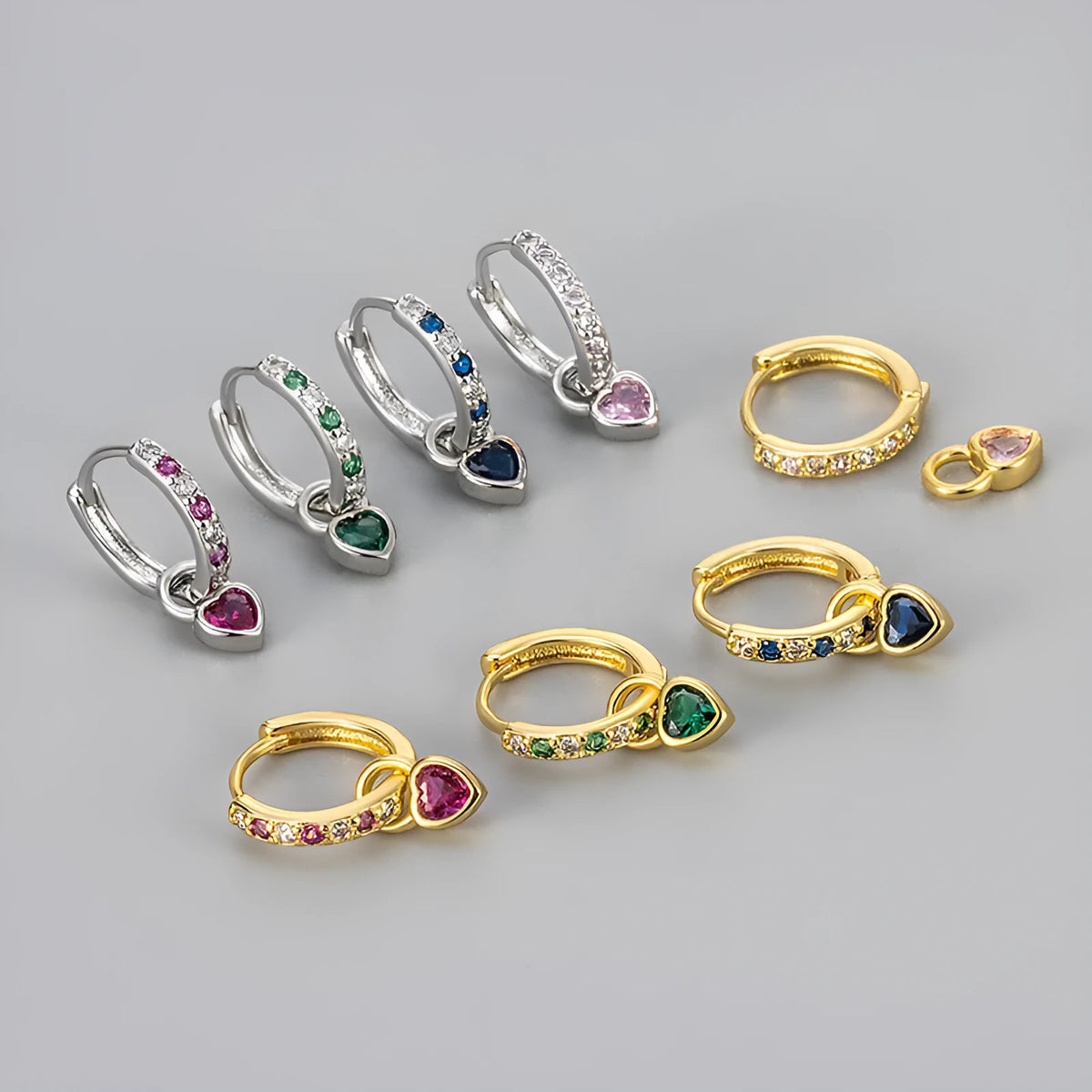 Women's fashion earrings with heart-shaped drops featuring coloured zircon stones in gold or white gold colour plating