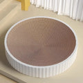 Round green cat scratching board made from corrugated cardboard with two replacement inserts