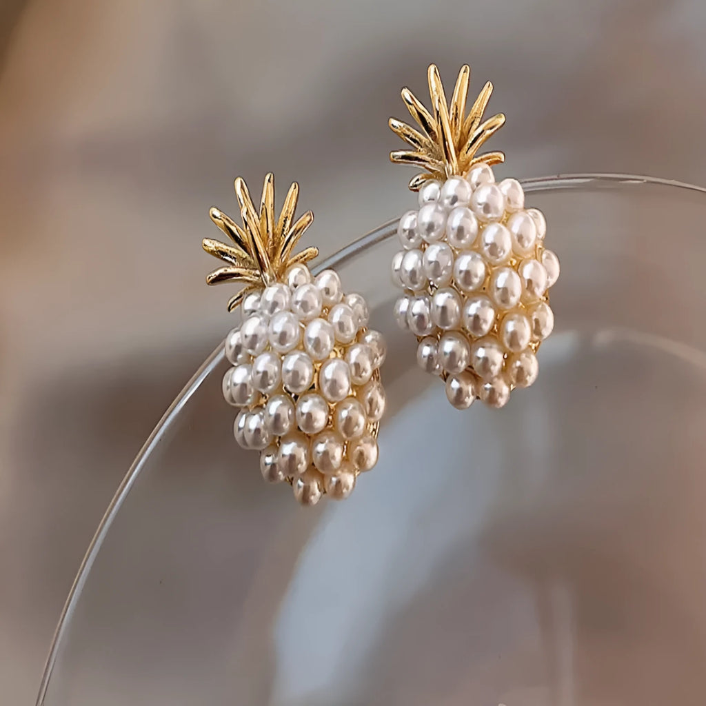 Korean style pineapple and starfish pearl design alloy earrings with electroplated gold, silver, pearl flower, and starfish pearl finishes.