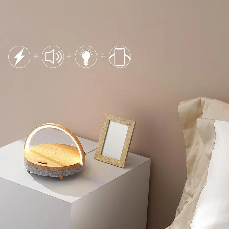 Wireless charging LED night light with Bluetooth speaker and phone holder in marble or wood grain finish