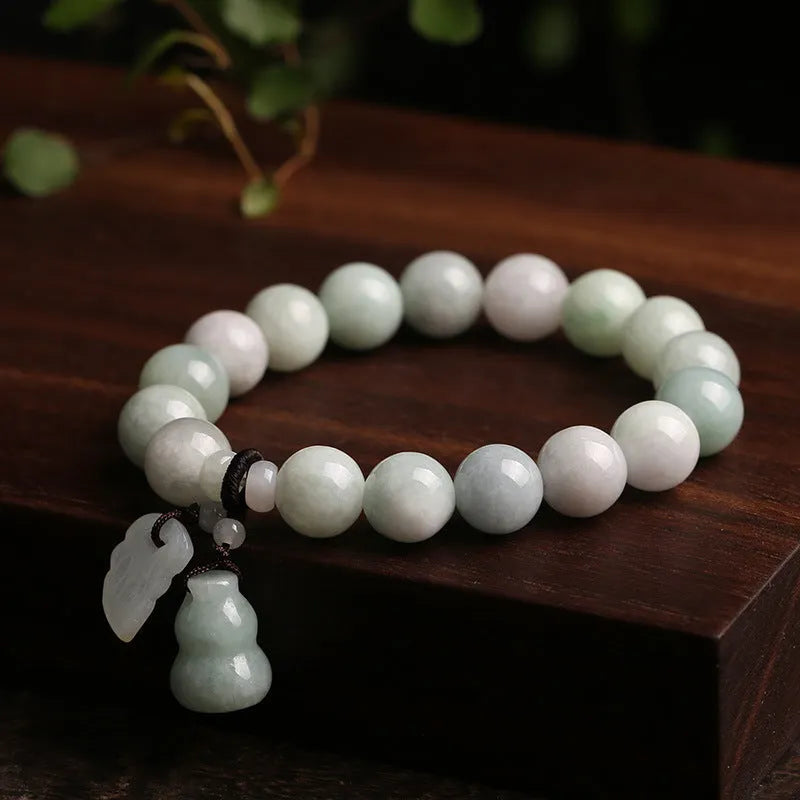 Natural jade bracelet with Maitreya Buddha charm and geometric design