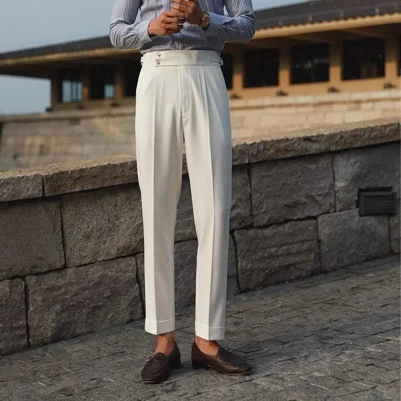 Men's slim fit straight-leg suit trousers in black, white, and apricot colours on a hanger.