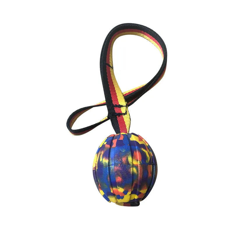 Yellow and camouflage coloured EVA floating dog chew balls in three different sizes on a blue background.