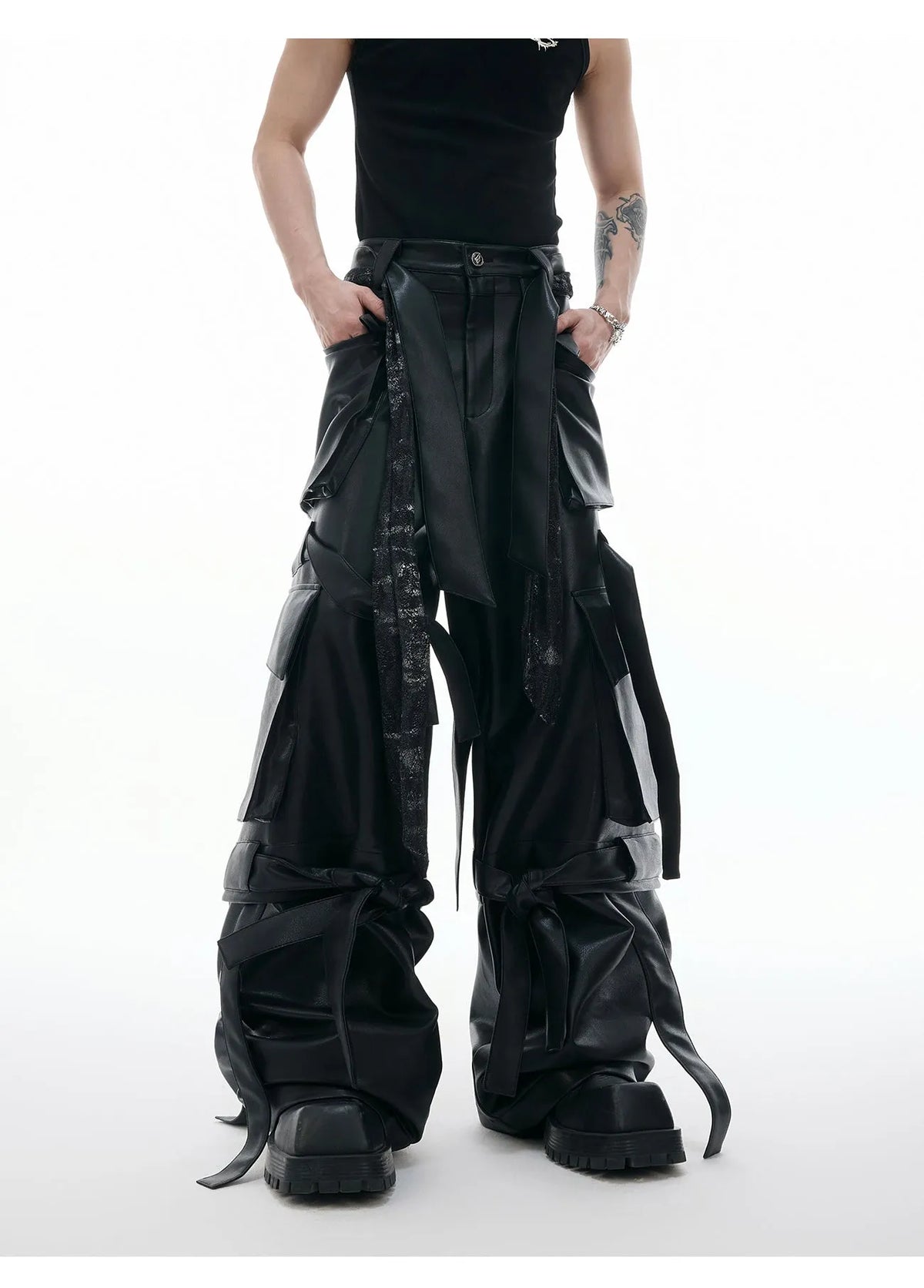 Black loose-fit men's trousers with quilted panels and multiple pockets.