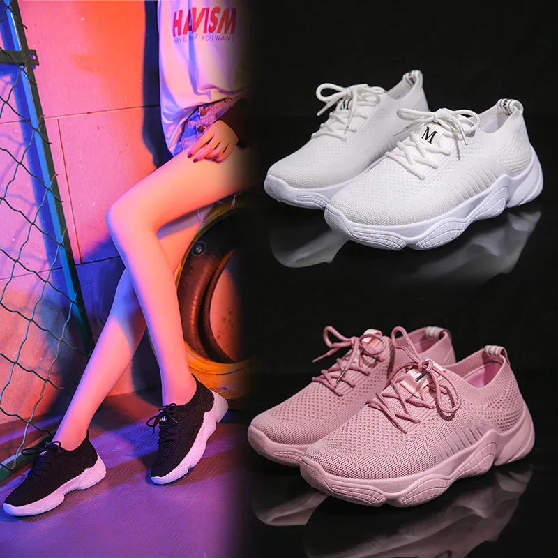 Women's low-top white woven sneakers with thick rubber sole and letter pattern detail