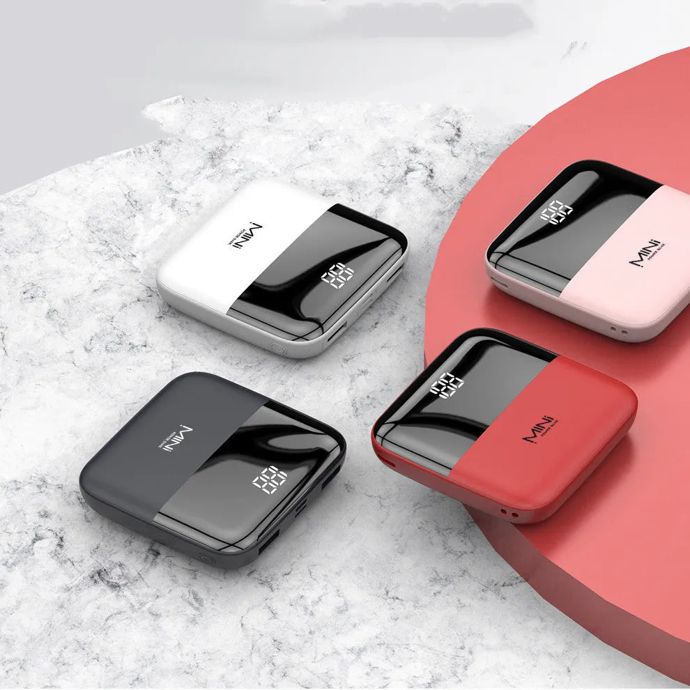 Android portable power bank with digital display and dual USB ports in black, pink, red, or white