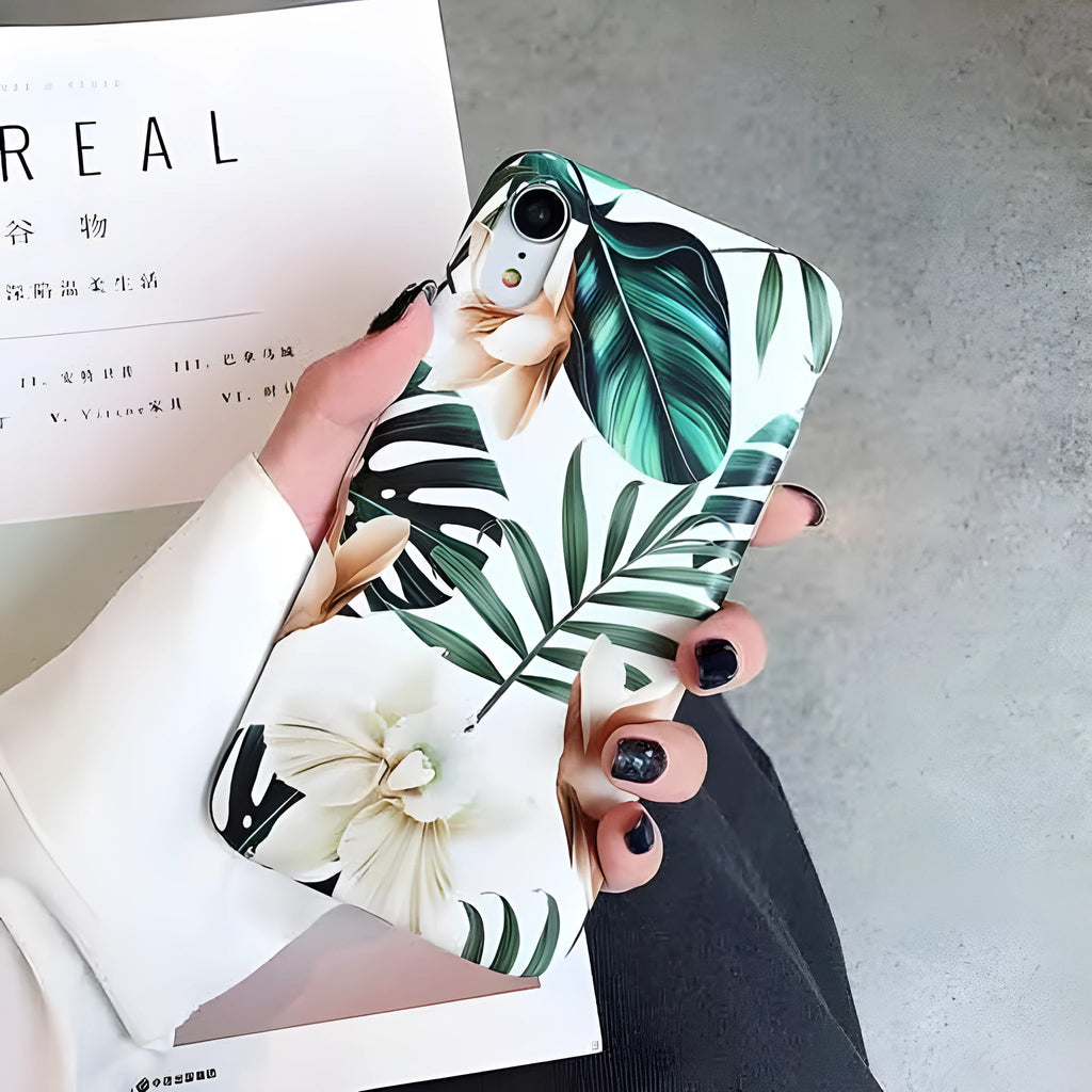 Floral banana leaf design on a flexible TPU phone case for compatible iPhone models.