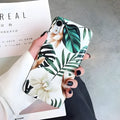 Floral banana leaf design on a flexible TPU phone case for compatible iPhone models.