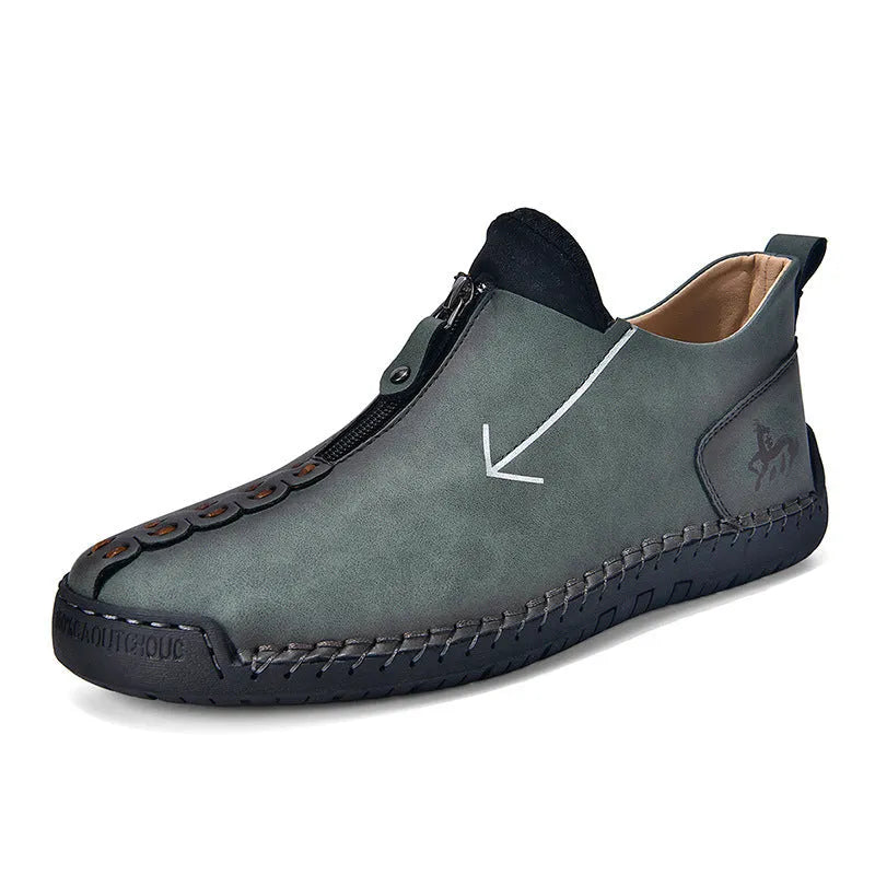 Men's black casual Martin boots with a front zip, round toe, and low rubber sole.