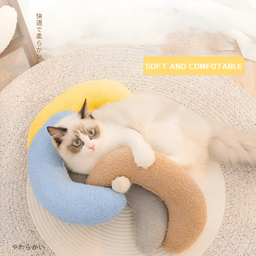 Blue U-shaped cat pillow with adjustable neck collar for sleeping support