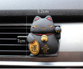 Resin fortune cat car vent aromatherapy clip in black or white.