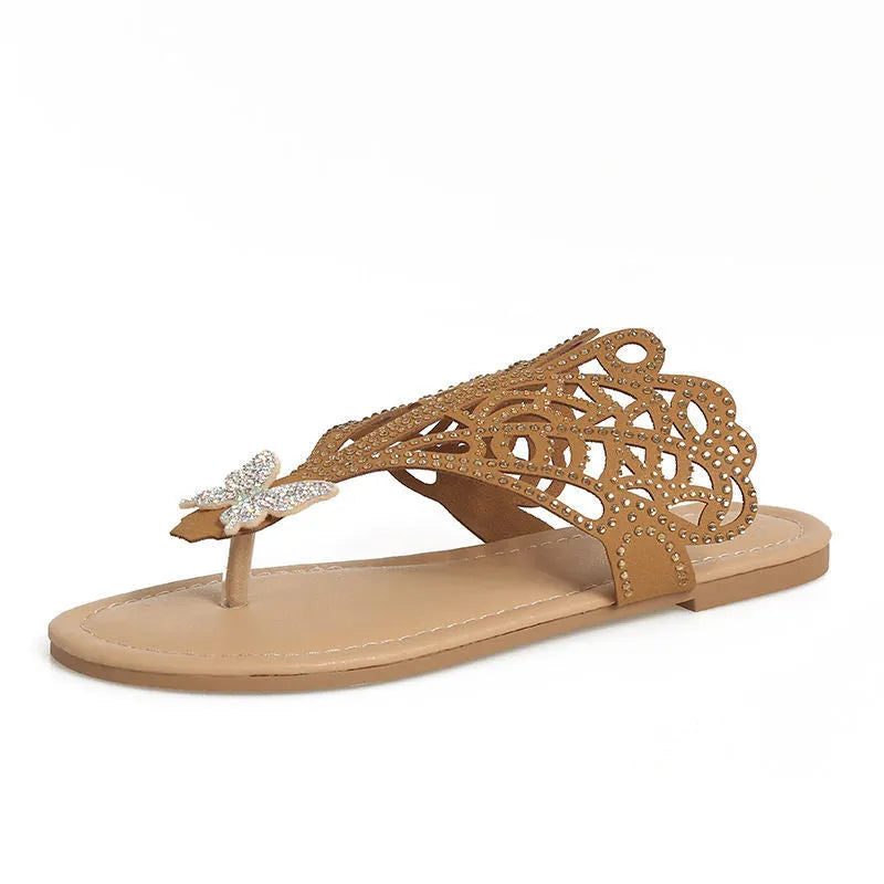 Women's gold slip-on sandals with rhinestone decoration and open flip-toe design.