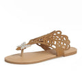 Women's gold slip-on sandals with rhinestone decoration and open flip-toe design.