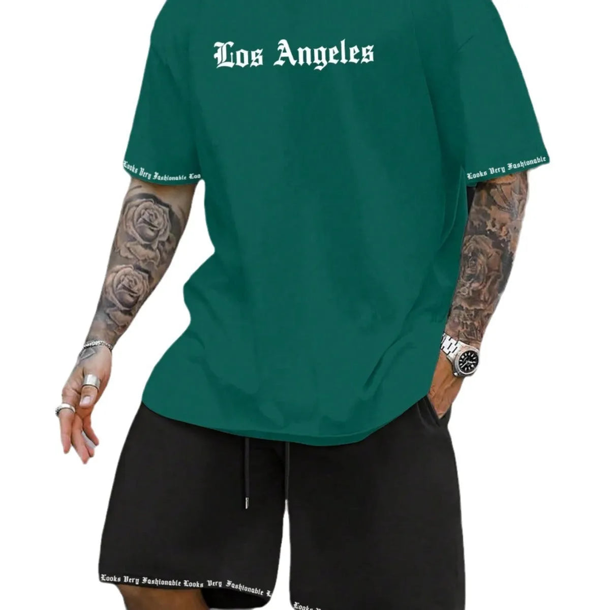 Mens blue sports style short sleeve top and shorts two-piece set on a plain background.